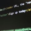 Detailed view of HTML and CSS code on a computer screen, concept of programming.